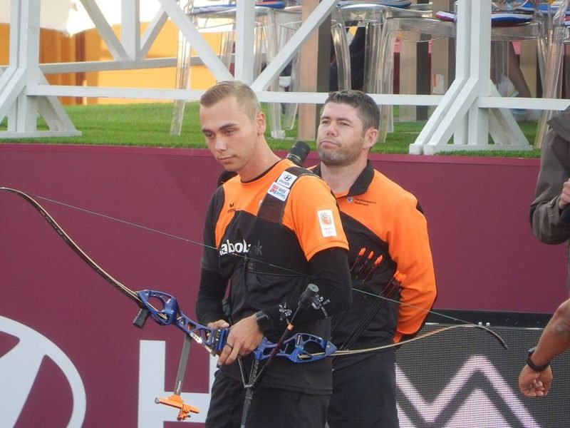 Recurve archers with proper stance and posture at a competition