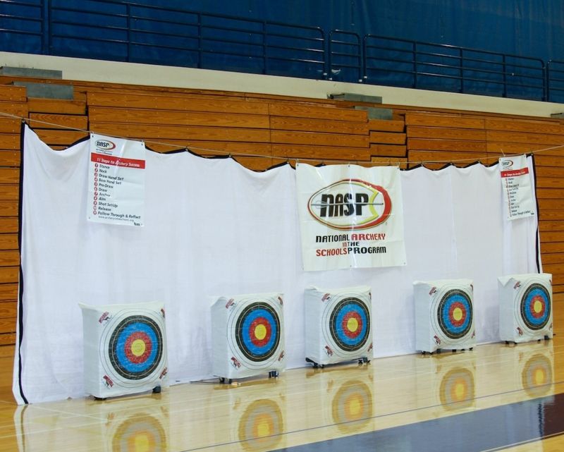 Archery range netting used as a backstop behind the targets