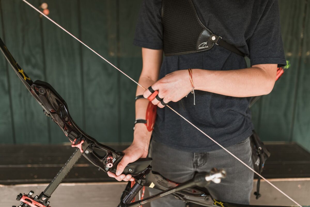 Recurve bow athlete preparing equipment for competition