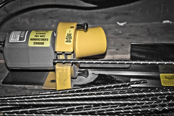 Arrow saw cutting carbon arrow shafts to length in small passes