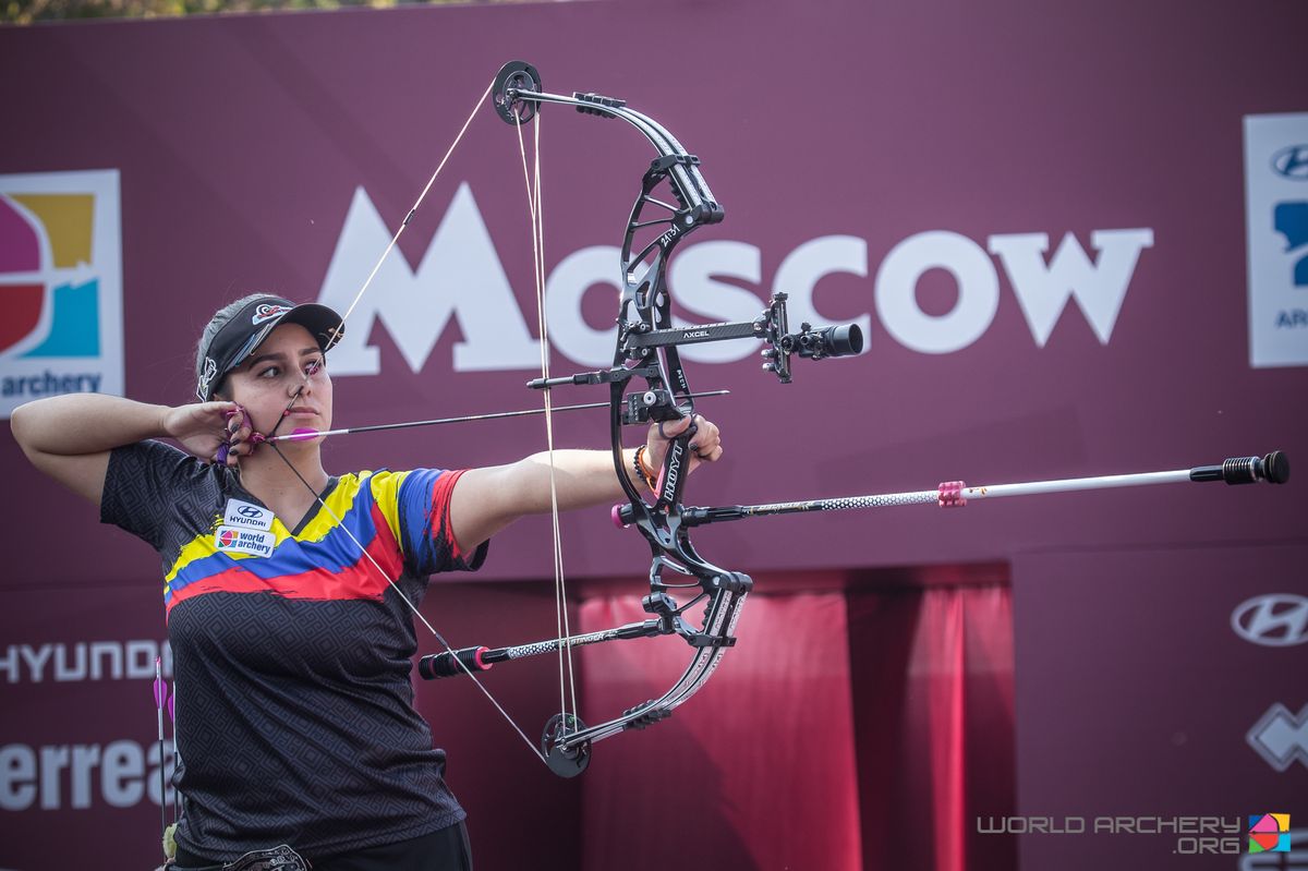 Compound archer at full draw with a spine-matched carbon arrow nocked