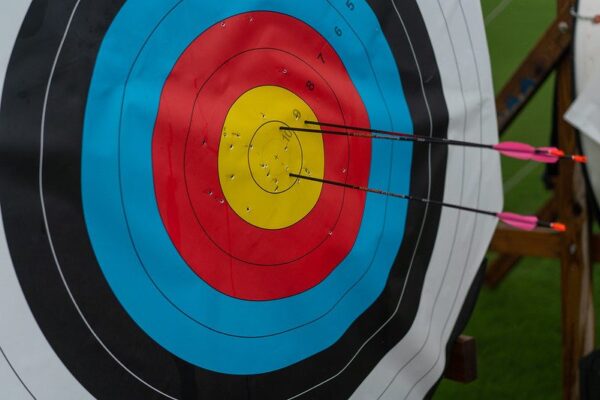 Arrows stuck in an archery target face before removal
