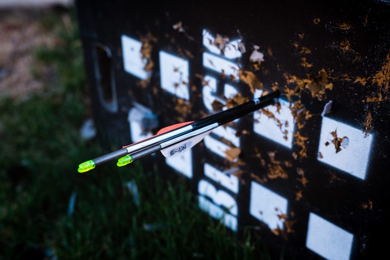 Bare shaft and fletched arrow grouping together in the target after tuning