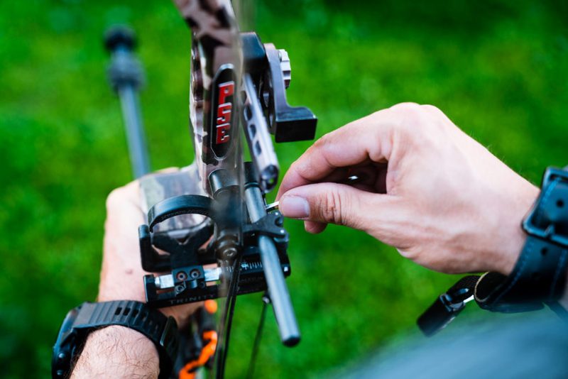 Adjusting the arrow rest on a compound bow during bare shaft tuning