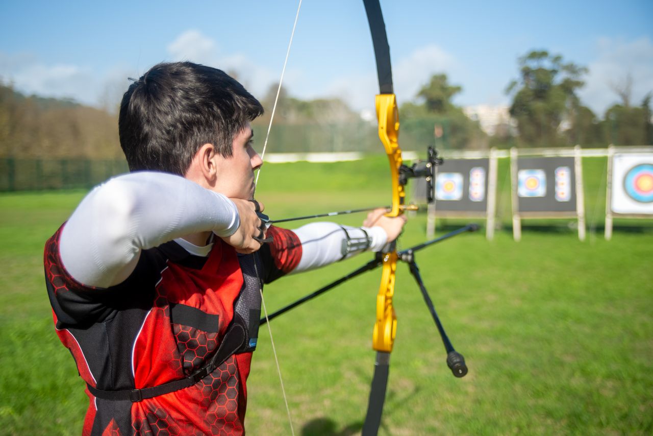 Recurve archer aiming at competition targets, demonstrating Brady Ellison archery form and mental focus
