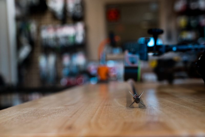 Broadhead standing on a bench for broadhead tuning after bare shaft tuning