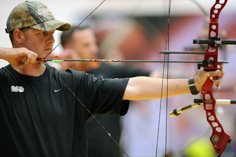 Compound archer at full draw during a championship competition