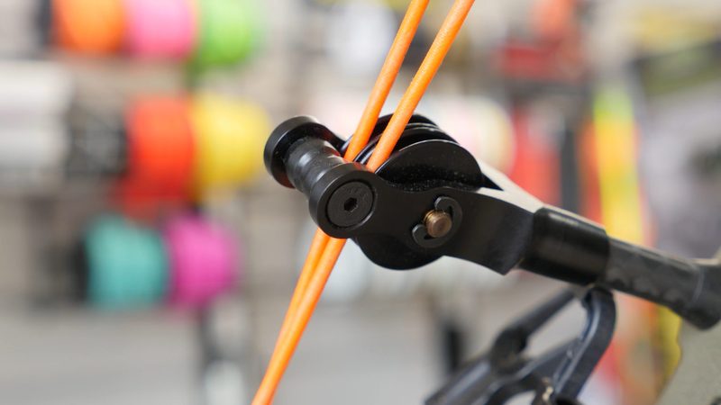 Compound bow cable guard and roller guard holding the cables clear of the arrow