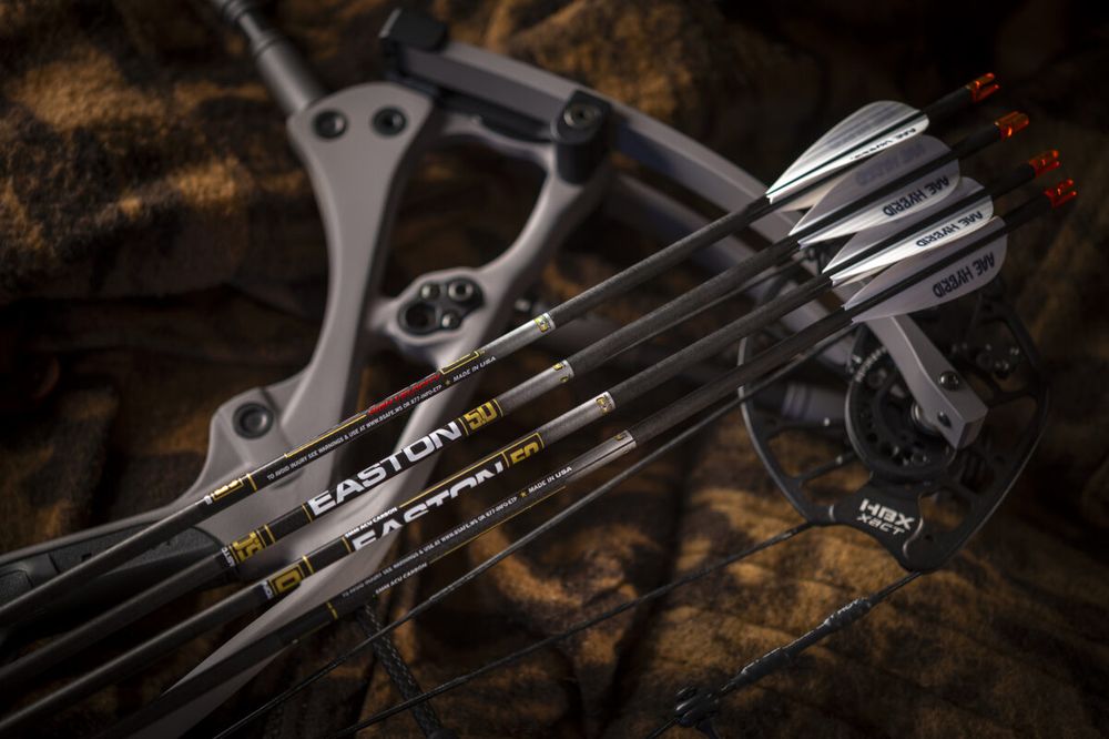 Carbon hunting arrows on a compound bow showing arrow spine size markings