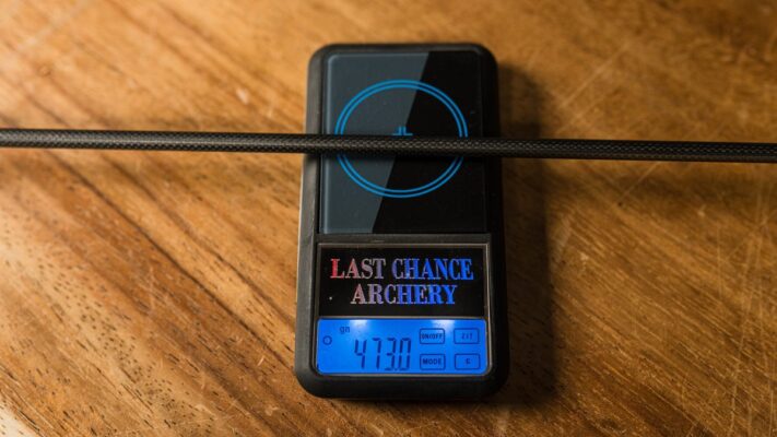 Digital archery scale weighing a hunting arrow shaft in grains