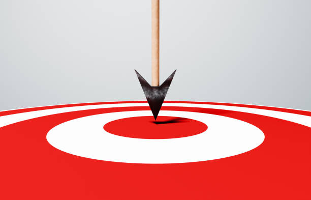 closeup of arrow hitting bulls eye - archery bullseye stock pictures, royalty-free photos & images