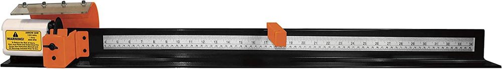 Measuring arrow length on an arrow saw rail before cutting to length