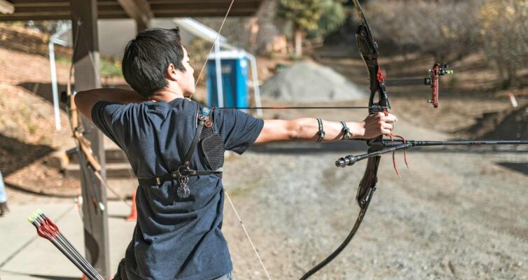 Recurve archer at full draw using back tension in archery
