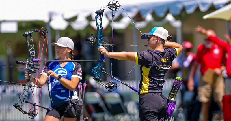 Compound archers shooting on an outdoor archery range