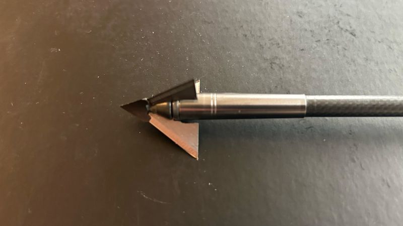 QAD Exodus three-blade fixed broadhead on an arrow