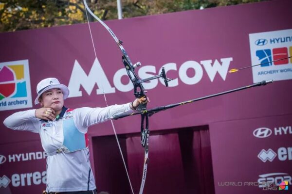 Recurve archer aiming with a bow sight at a World Cup final