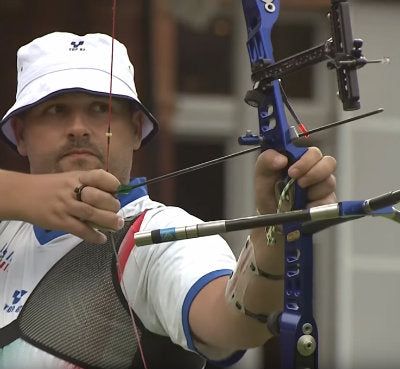 Recurve archer at anchor waiting for the archery clicker to click
