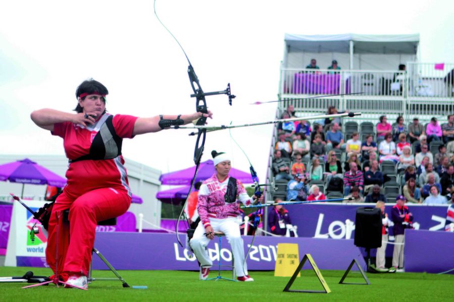 Recurve archer at full draw where arrow spine affects accuracy