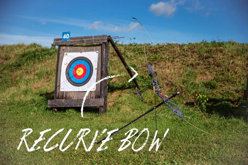 Recurve bow leaning against an outdoor archery target