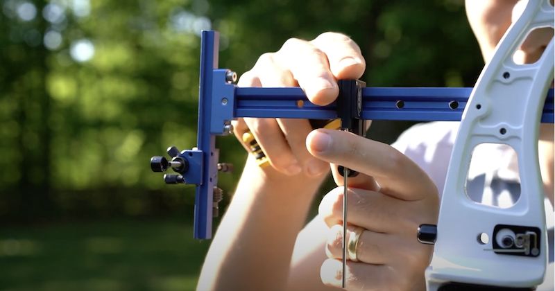 Setting up an archery clicker on a recurve bow riser