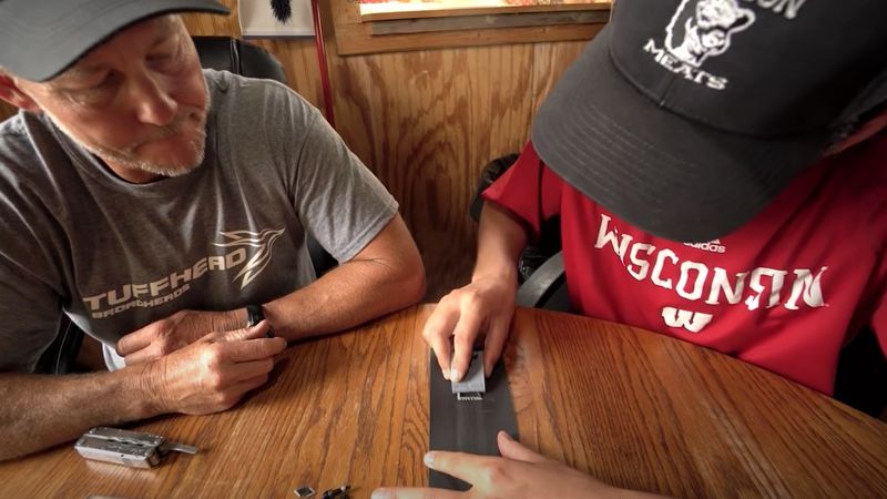 Sharpening broadheads on a stone following a step by step guide
