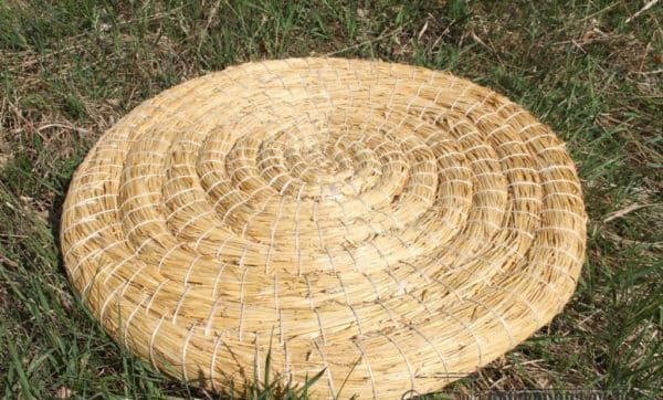 Top view of a tightly coiled straw bale archery target
