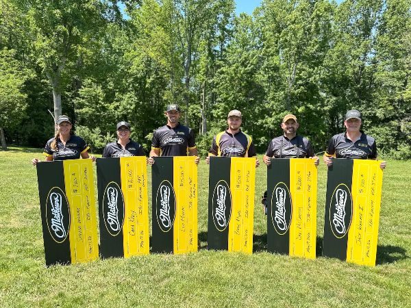 Team Mathews athletes holding awards at the 2026 IBO Triple Crown archery competition