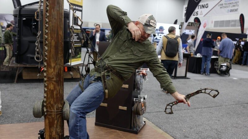 Hunter testing the Tethrd Phantom XP saddle with patent-pending Lace Lock Tensioner at a trade show demonstration