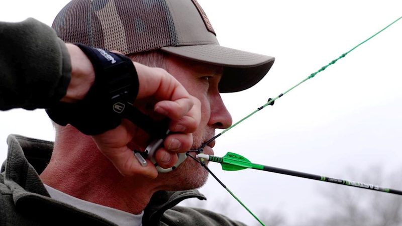 Compound archer at anchor position demonstrating breath control technique for archery