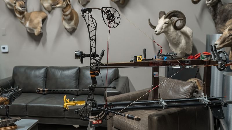 compound bow on draw board showing drop-away arrow rest position and timing