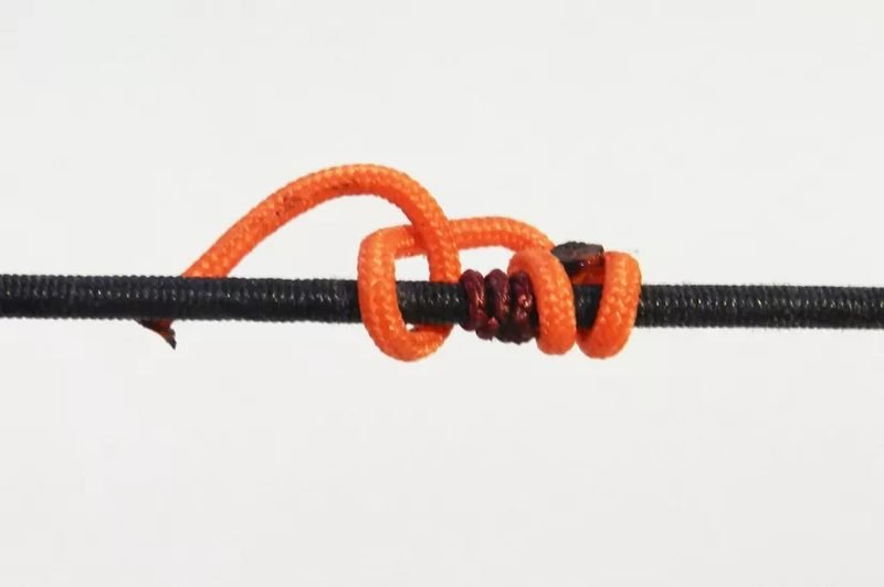 Installing second D-loop knot on the bowstring