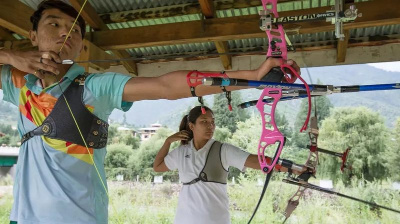 Recurve archers practicing outdoor shot technique and breathing control