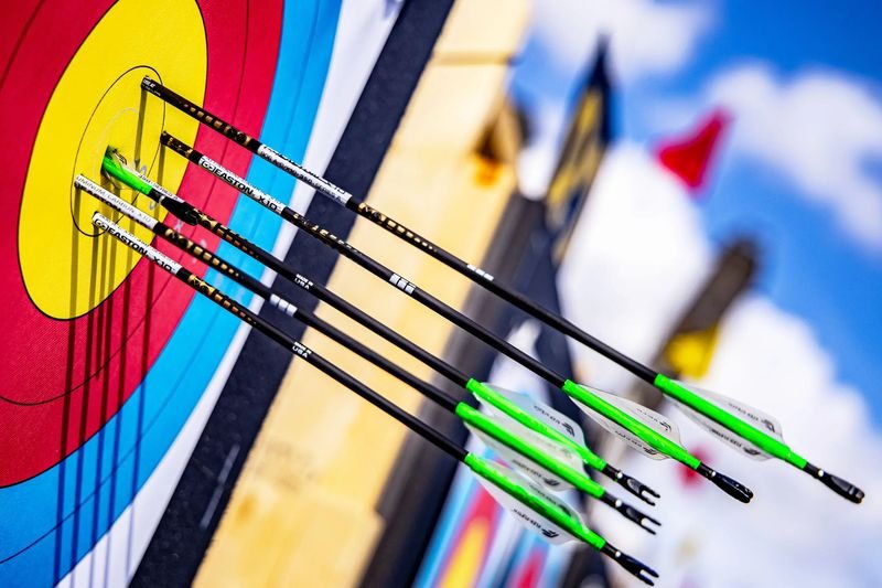 Easton X10 carbon target arrows grouped in Olympic archery target face